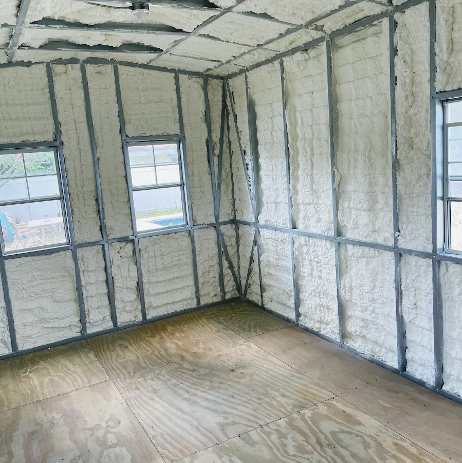 Closed-cell spray foam insulation applied to wall cavities in a residential project in Groton